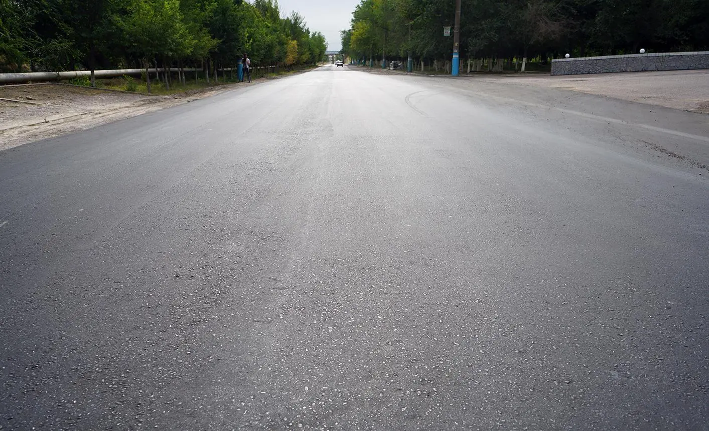Fresh asphalt private roadway
