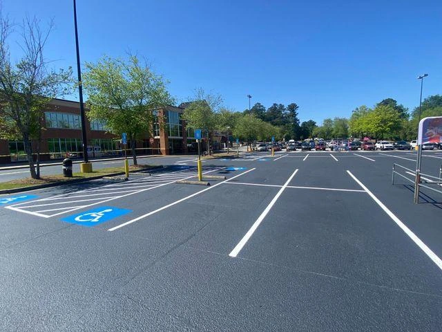 Freshly sealcoated and striped asphalt parking lot